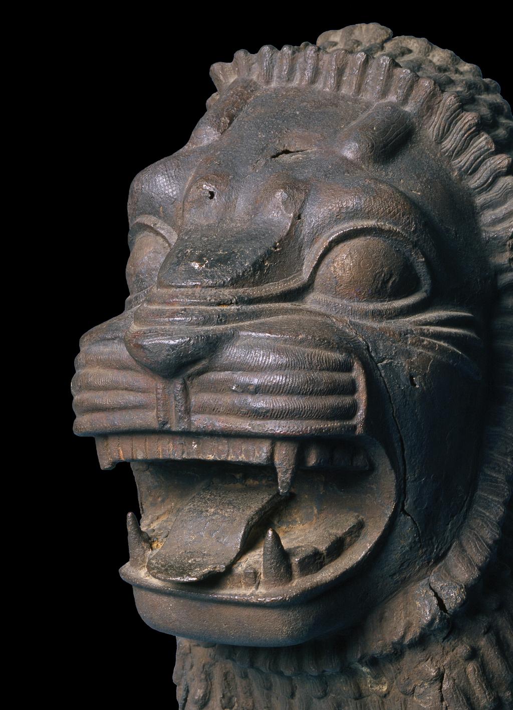 An image of Architectural element/door lintel. Forepart of a hollow cast lion, probably from a door lintel. Find Spot: Shibam? Hadramat, South Arabia. Copper alloy, length 0.556 m, width 0.285 m, circa 800-601 BC.