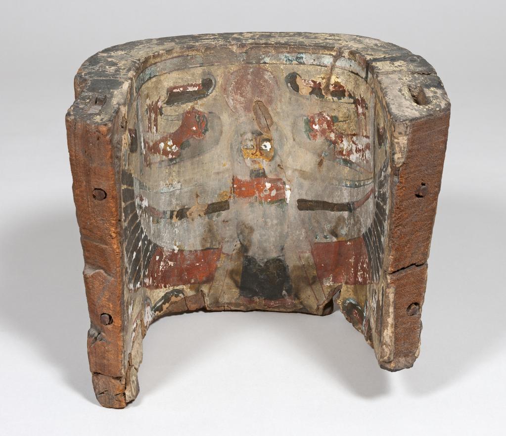 An image of Funerary Equipment/Coffin. Fragment of a painted anthropoid coffin. The inside is decorated with an image of a ba-bird and the outside is decorated with a text, which has been covered by a thick pitch-like substance. Production Place: Egypt. Painted wood, carved, height 27 cm, width 32 cm, circa 955-735 B.C. Third Intermediate period.