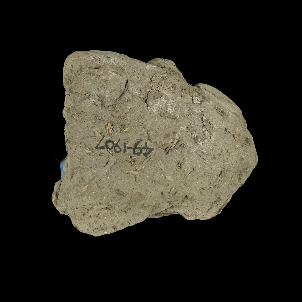 An image of Jewellery. Beads, embedded in mud. Find Spot: Thebes (Egypt), Deir el-Bahri. Height 0.07 m. Eighteenth Dynasty. New Kingdom.