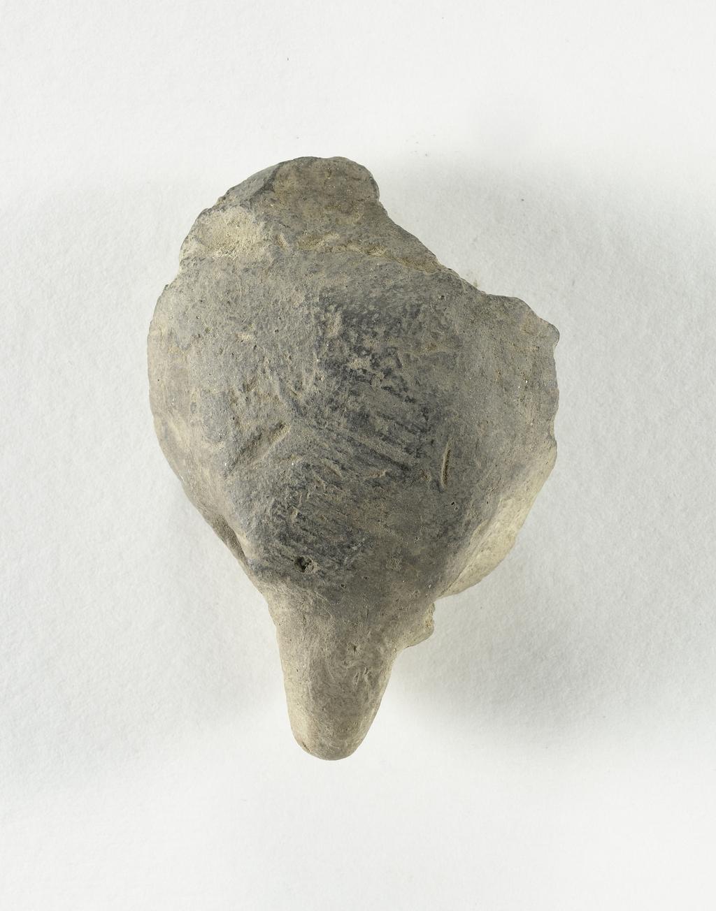 An image of Animal (?) head, unidentified. Find Spot/Production: Egypt, Abydos. Height 0.025 m, length 0.06 m.