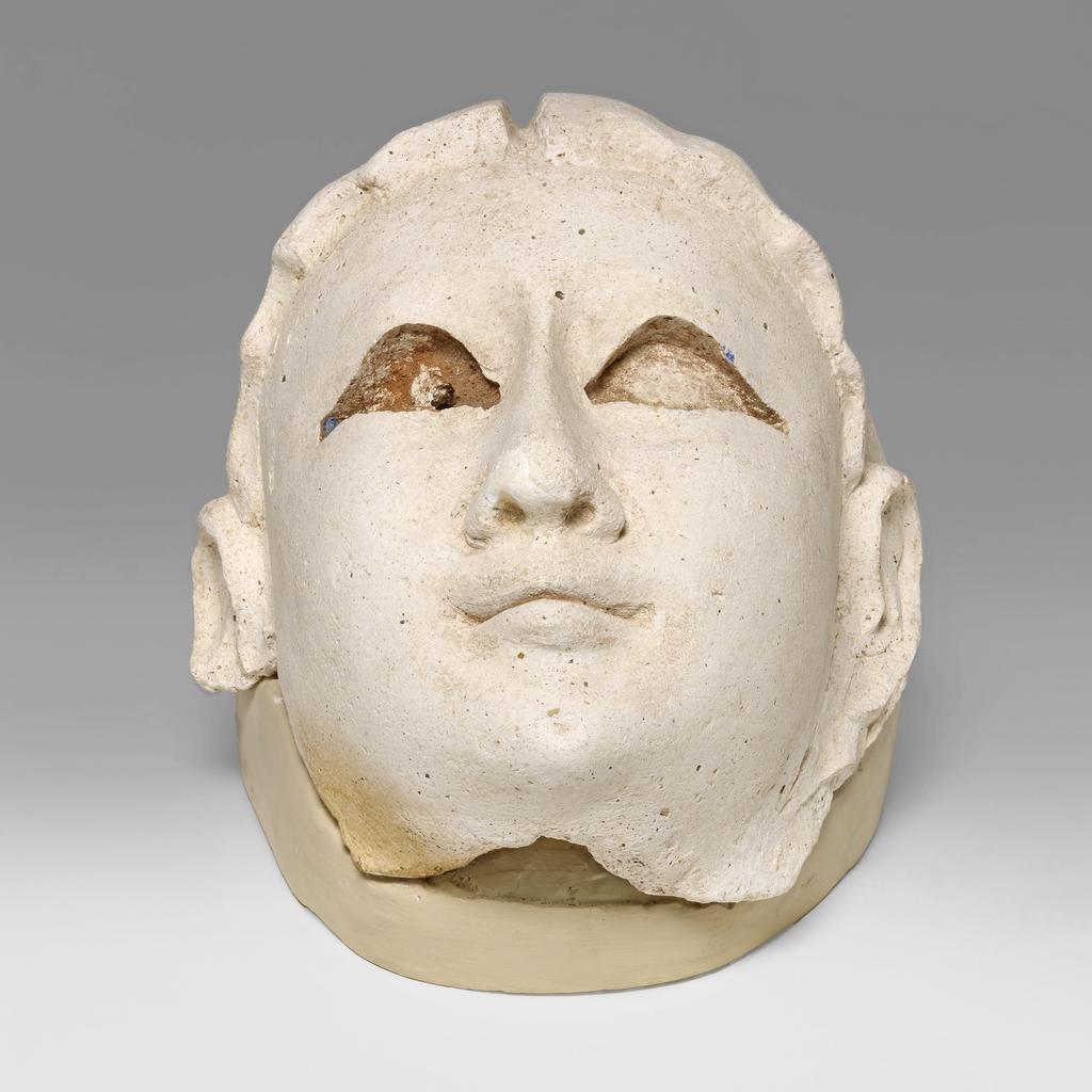 An image of Mummy trappings. Mummy mask, female (?). Production Place/Find Spot: Egypt. Height 0.2 m, length 0.143 m. Roman Period.