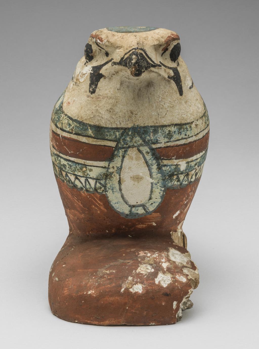 An image of Funerary Equipment/Figurine. Mummified falcon figure. Production Place: Egypt. Wood, height 0.165 m.