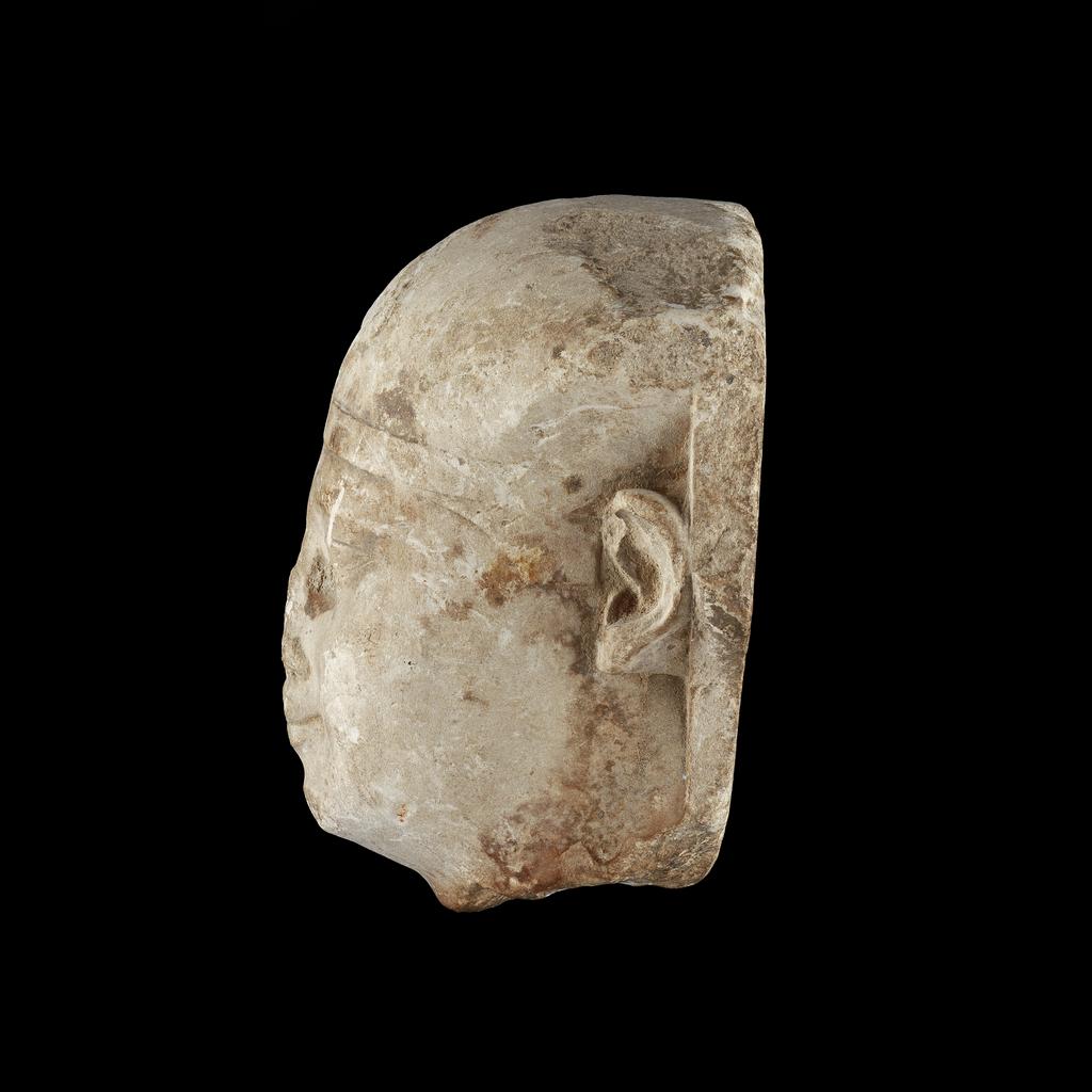 An image of King's head, sculptors model. Production Place/Find Spot: Egypt. Carved limestone, circa 332 to circa 30 B.C. Ptolemaic Period. Production Note: Rulers of Dynasty 30 and the Ptolemaic period used this 'portrait type'. The continuation was probably a deliberate attempt to associate the new Greek rulers with the last Egyptian dynasty.