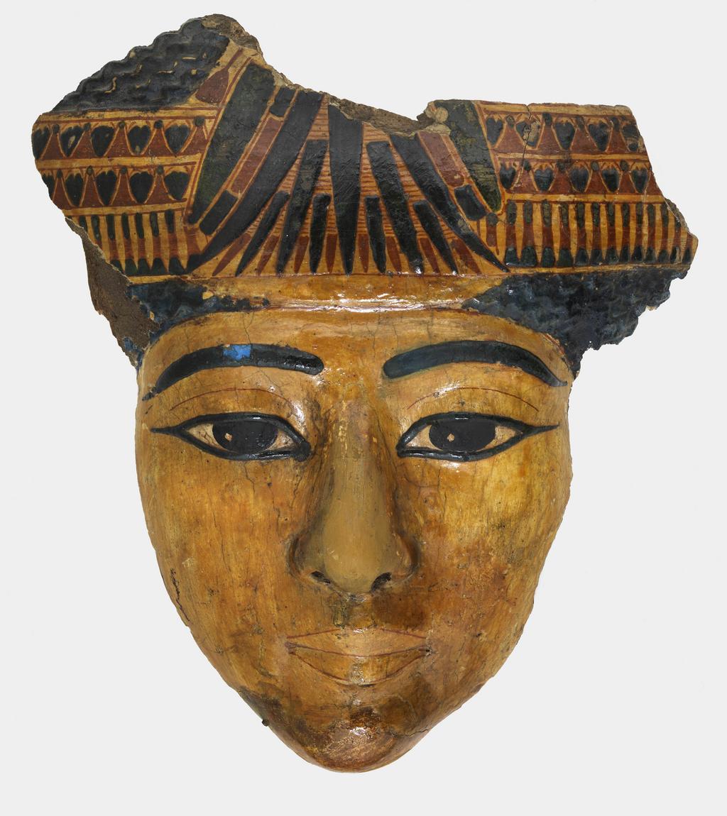 An image of Funerary equipment. Face from coffin, polychrome and varnished. Chin and nose heavily restored during the Twentieth Century. Production Place: Egypt. Find Spot: Thebes. Width 21.7 cm, height 24.6 cm, thickness 5.4 cm, 1070-735 B.C. (dating not confident). Twenty-first Dynasty. Third Intermediate period.
