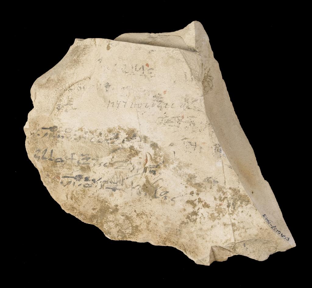 An image of Written Document. Ostracon, hieratic text, both sides, black and red ink. Production Place/Find Spot: Egypt. Limestone, length 0.149 m, width 0.177 m. New Kingdom.