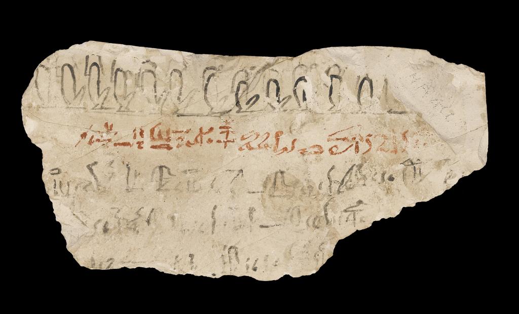 An image of Written Document. Ostracon, hieratic text, one side, black and red ink. Production Place/Find Spot: Egypt. Limestone, length 0.09 m, width 0.18 m. New Kingdom.