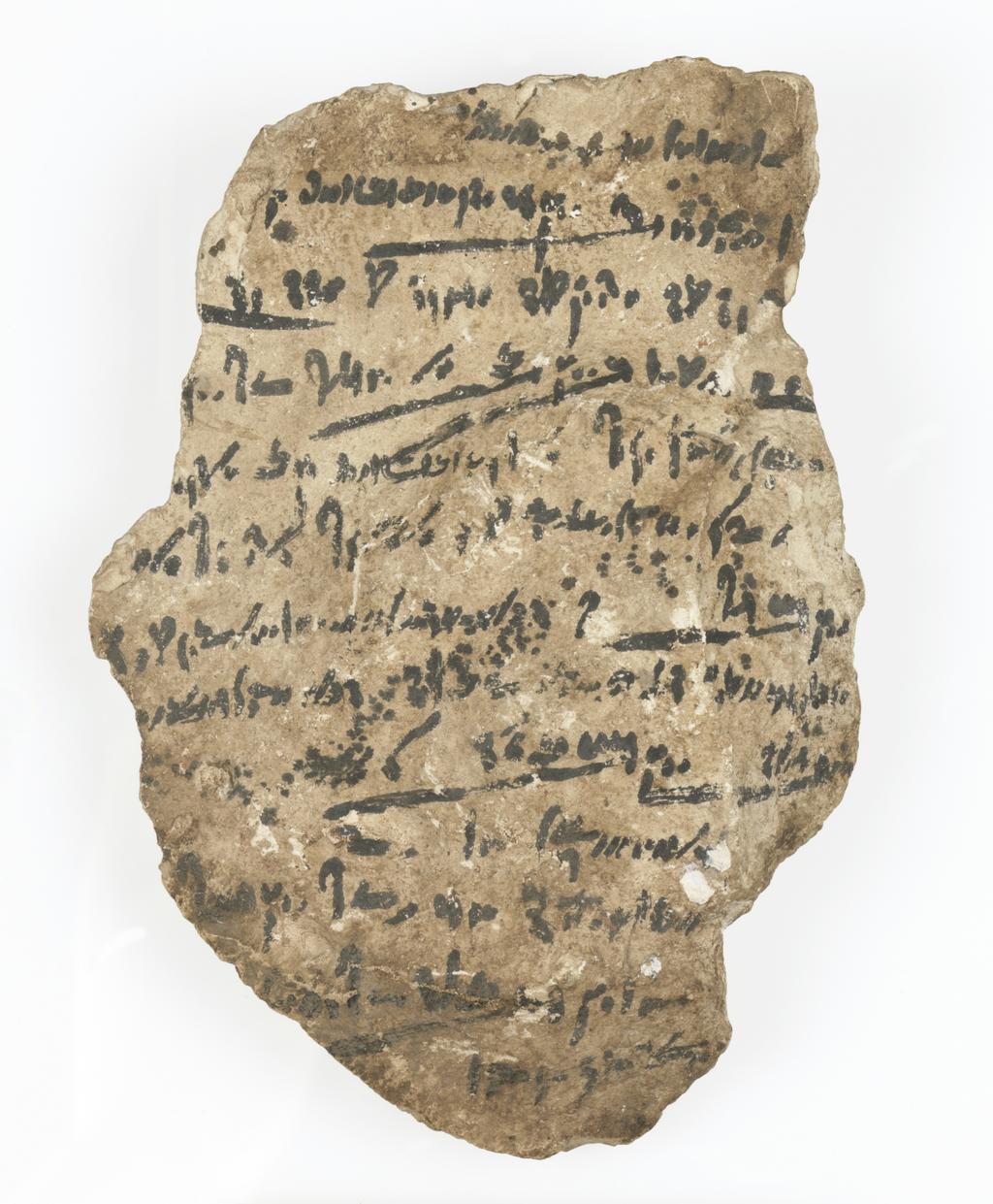 An image of Written document/Ostracon. Demotic text, one side. Production Place/Find Spot: Egypt. Limestone, depth 0.005 m, length 0.162 m, width 0.112 m. Ptolemaic Period.