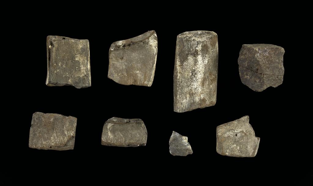 An image of Stone and mineral fragments, in box. Egyptian.