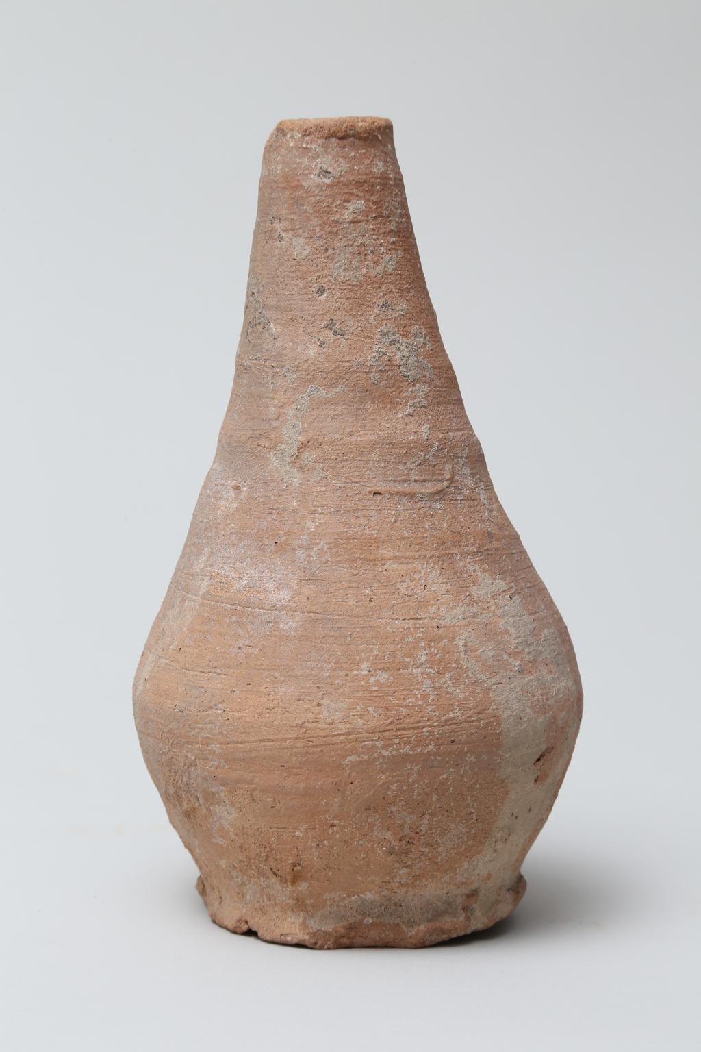 An image of Vessel. Jar, with long thin neck, bottle shape. Production Place/Find Spot: Egypt. Height 0.1575 m.