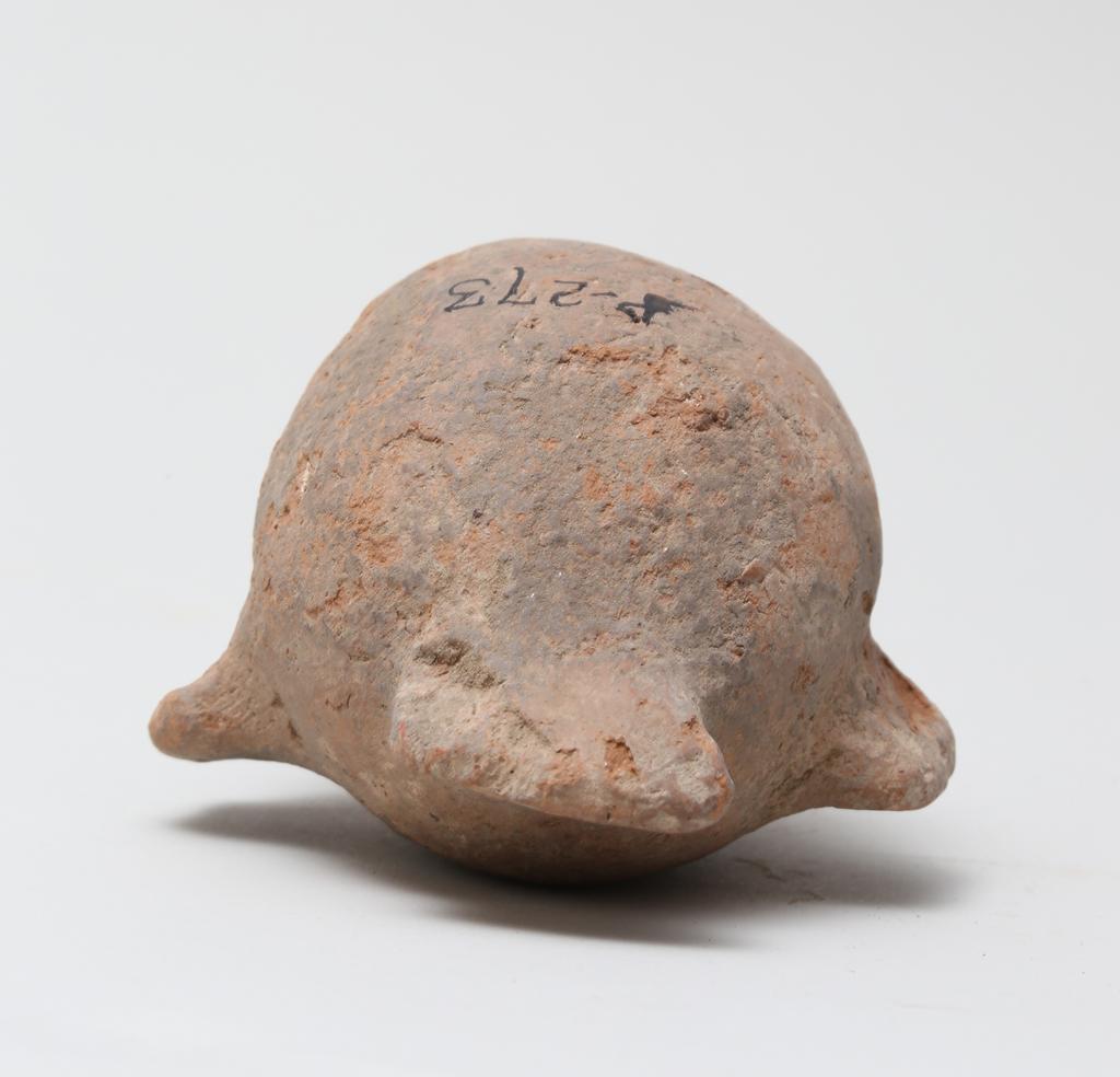An image of Vessel. Jar, in the form of a bird ?, head missing. Find Spot: Naukratis?, Egypt. Production Place: Egypt. Height 0.105 m.