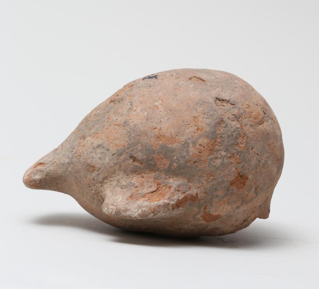An image of Vessel. Jar, in the form of a bird ?, head missing. Find Spot: Naukratis?, Egypt. Production Place: Egypt. Height 0.105 m.
