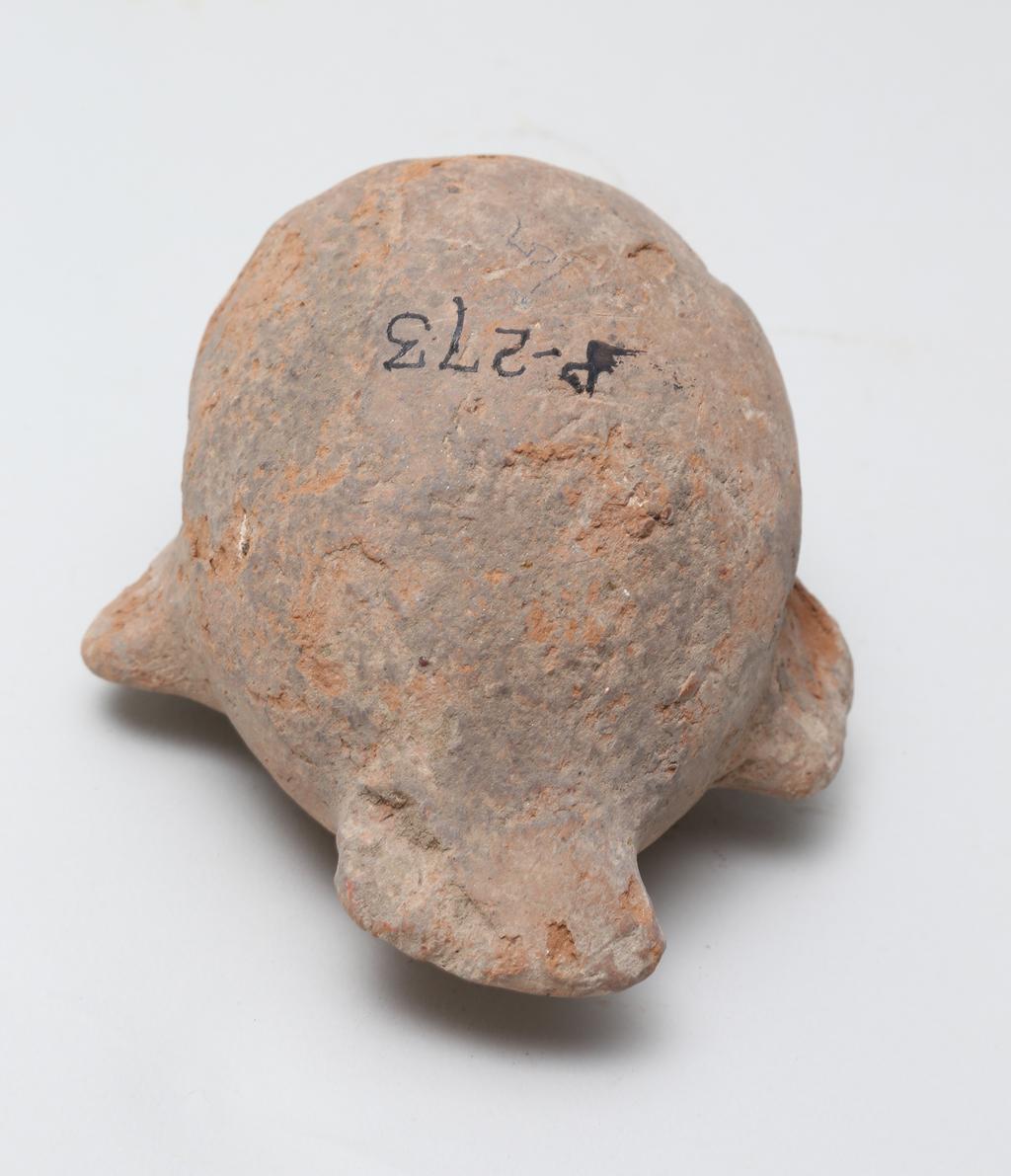 An image of Vessel. Jar, in the form of a bird ?, head missing. Find Spot: Naukratis?, Egypt. Production Place: Egypt. Height 0.105 m.