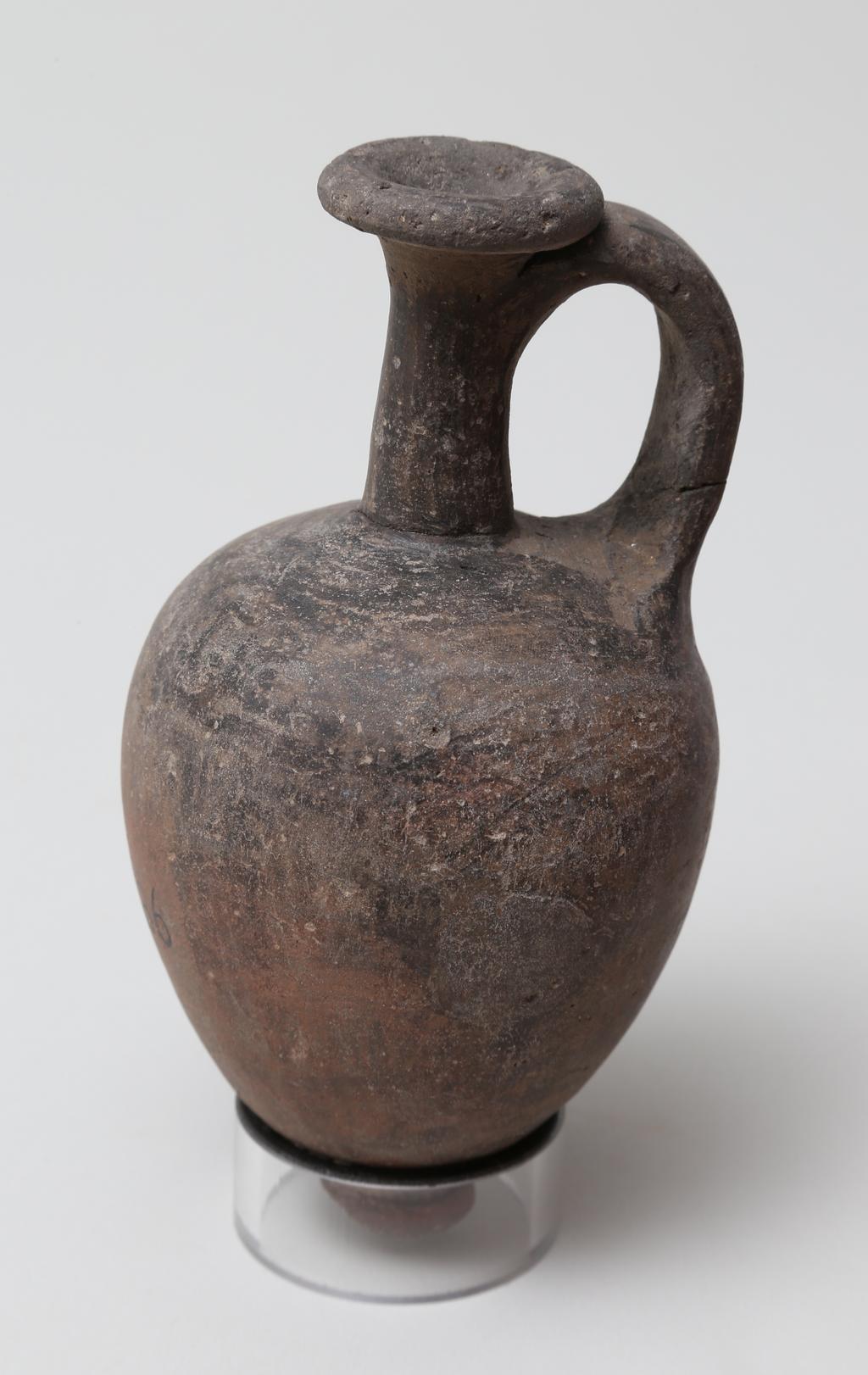 An image of Vessel. Jug, with ring base. Production Place/Find Spot: Egypt. Diameter 0.066 m, height 0.12 m. Twelfth Dynasty. Middle Kingdom-Second Intermediate Period.