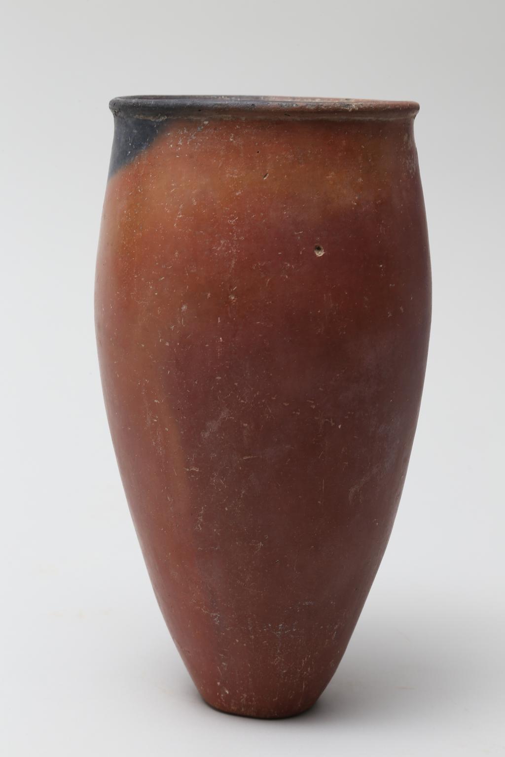 An image of Vessel. Jar, slender with black rim. Production Place/Find Spot: Egypt. Height 0.214 m, diameter, rim, 0.101 m, width, body, 0.112 m, c. 4500-3500 B.C. Nagada II & Predynastic period.