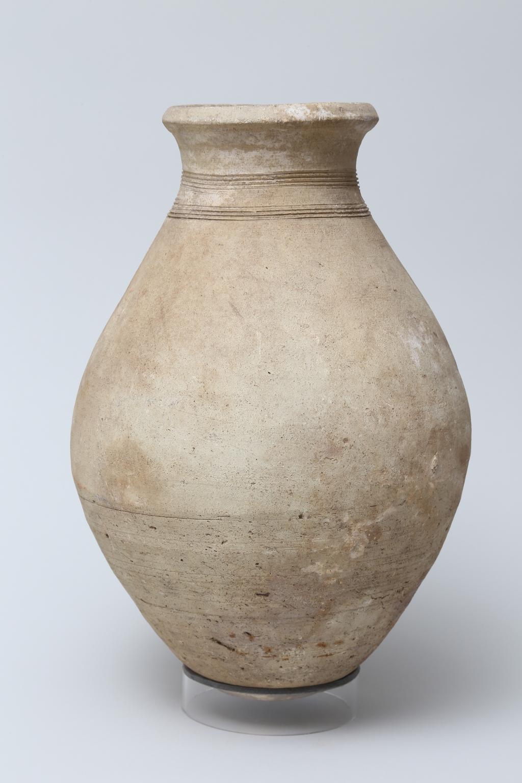An image of Vessel. Flask, with 2 bands of decoration around neck and 2 pot marks. Production Place/Find Spot: Egypt. Height 0.31 m. Eighteenth Dynasty. New Kingdom.