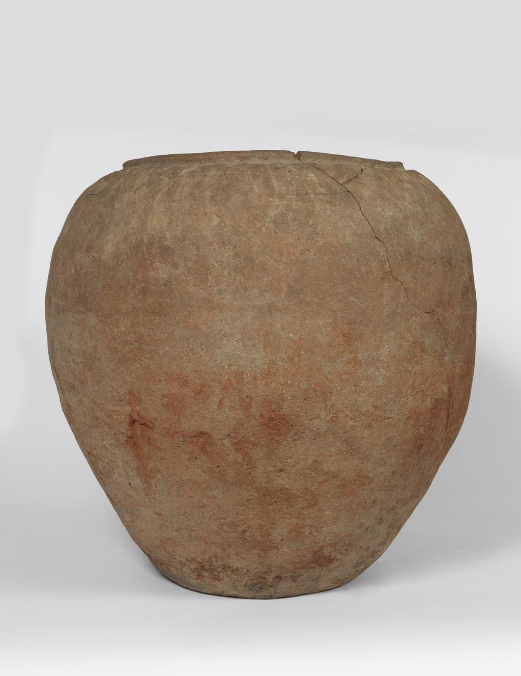 An image of Clay vesselThe skeleton found in this jar was that of a child. A flint and a couple of pottery vessels accompanied the body.C.-2707 - 2170