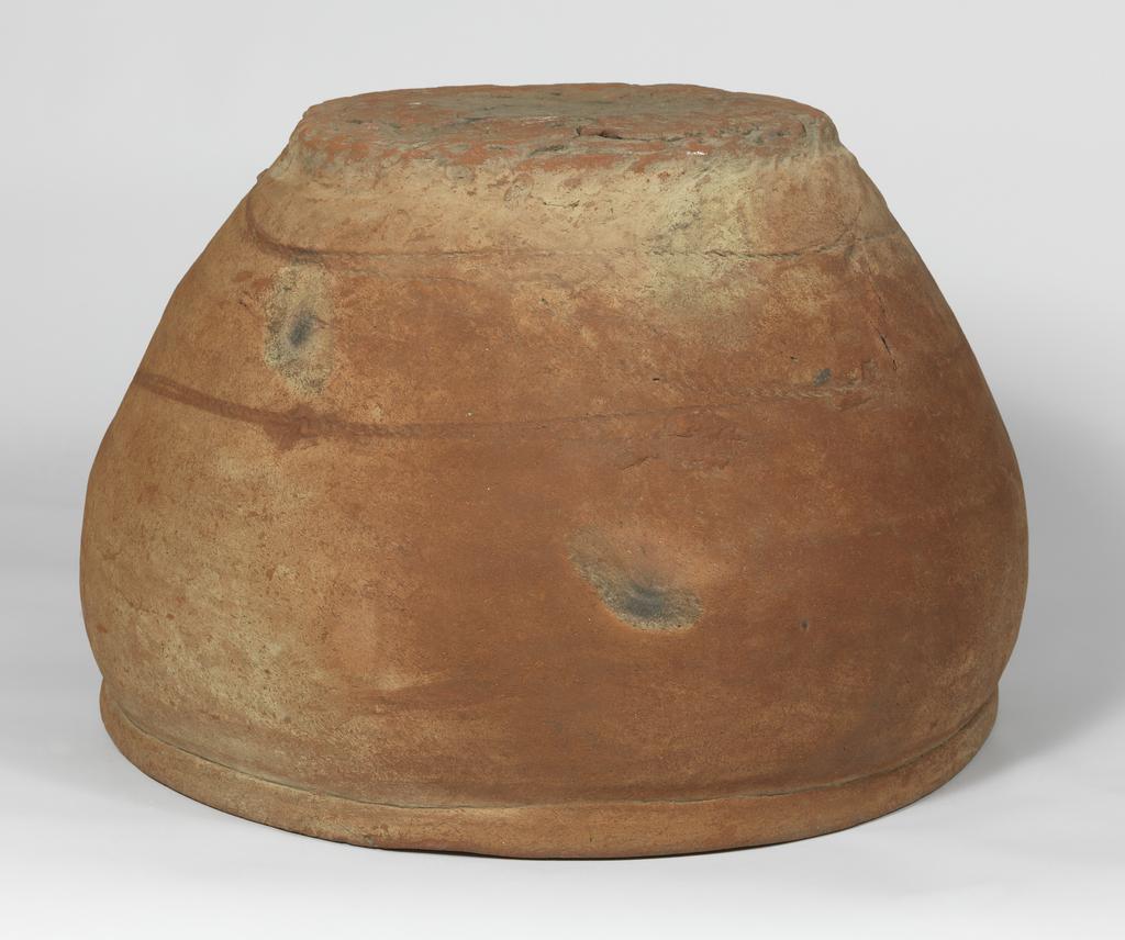 An image of Clay vesselRope marks can be seen clearly on the exterior of this large vessel. Such objects were used in burials and also as lids for pot burials.