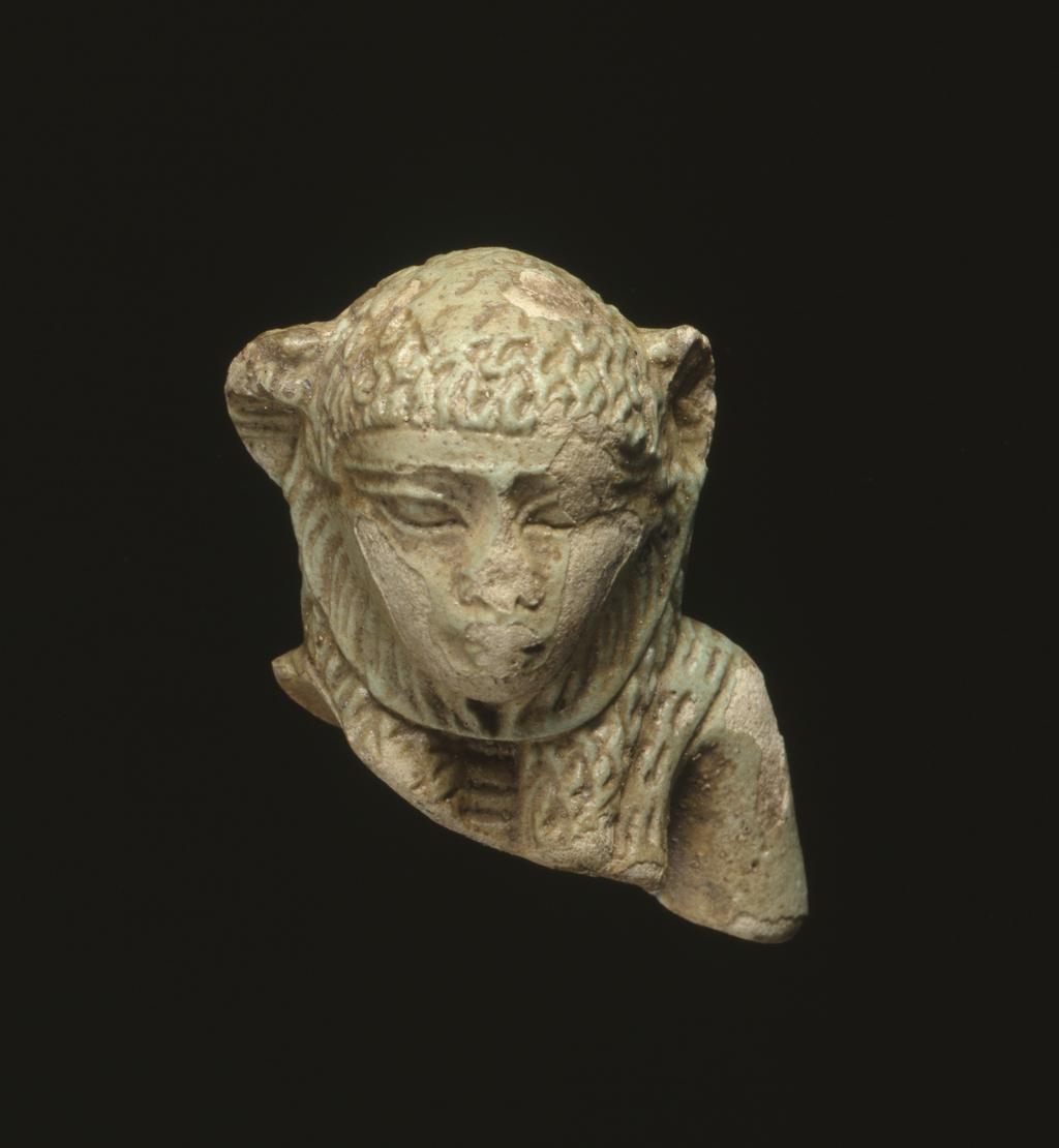 An image of Figure/statuette. Lion head with human face, body missing. Find Spot/Production Place: Egypt. Length 0.036 m.