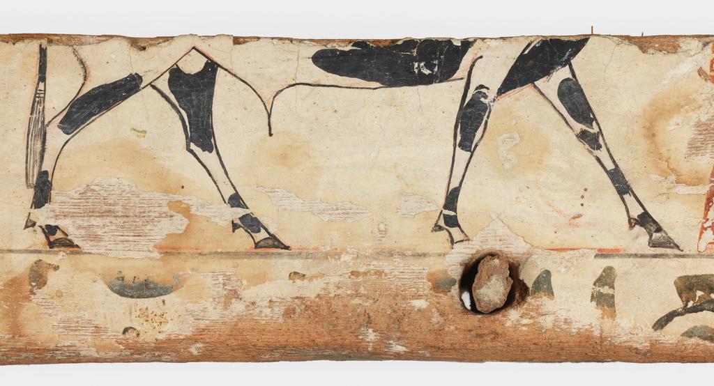 An image of Funerary Equipment. Coffin fragment of Wepwawetemhat, a master physician. This fragment comes from the bottom edge of the long side of the coffin box. Production Place: Egypt. Find Spot: Asyut(?), Egypt. Wood, painted, width 75.3 cm, height 8.9 cm, thickness 3.4 cm, circa 1975-circa 1790 B.C. Middle Kingdom.