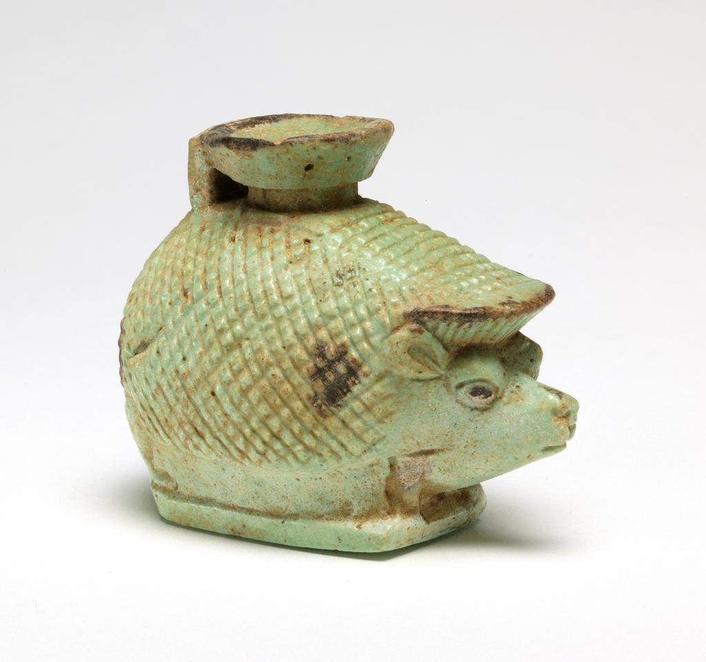 An image of Aryballos cosmetic vessel in the form of a hedgehog. Dimensions height 0.054 m, length 0.066 m, width 0.041 m.