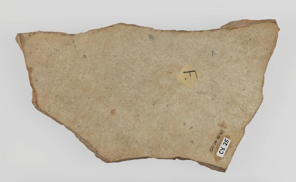 An image of Figure/Statue. Fragment of male statue. Production Place: Cyprus. Find Spot: Salamis, Temple of Apollo, Cyprus. Clay, moulded, height 0.214 m, width 0.124 m, 600-501 B.C. Archaic Period.