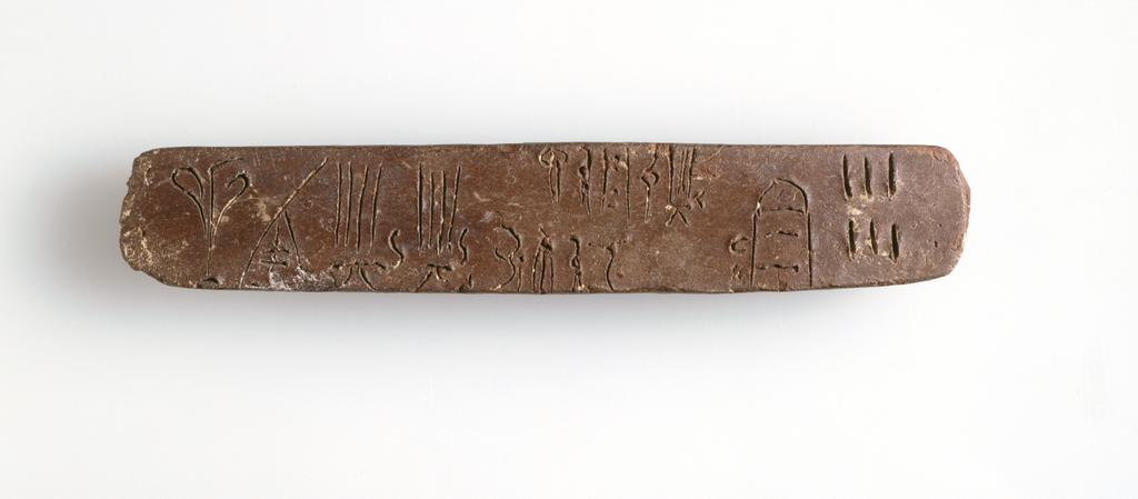 An image of Name: writing-tablet Description: tablet, linear B Dimensions: height 0.014 m, length 0.121 m Production Place: Crete Greek IslandsPeriod: Minoan, Bronze Age