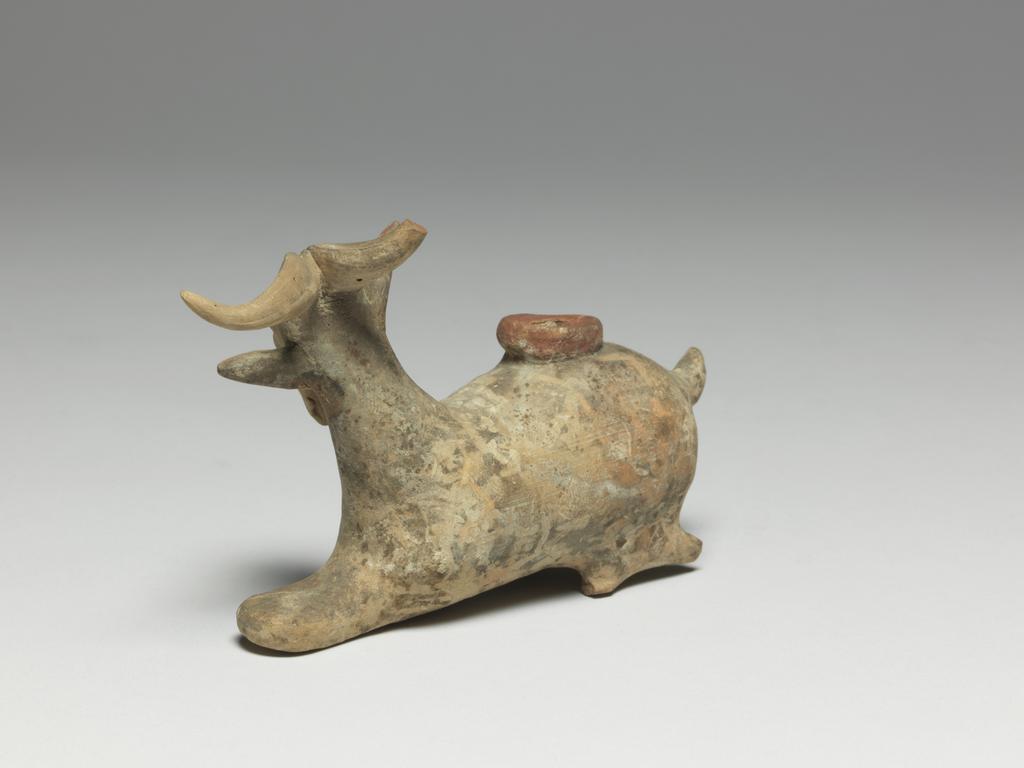 An image of Cosmetic Vessel. Goat, perfumed-oil container. Production Place: East Greece Turkey. Find Spot: Cyprus. Clay, height 0.083 m, length 0.135 m, 600-501 B.C. Archaic Period.