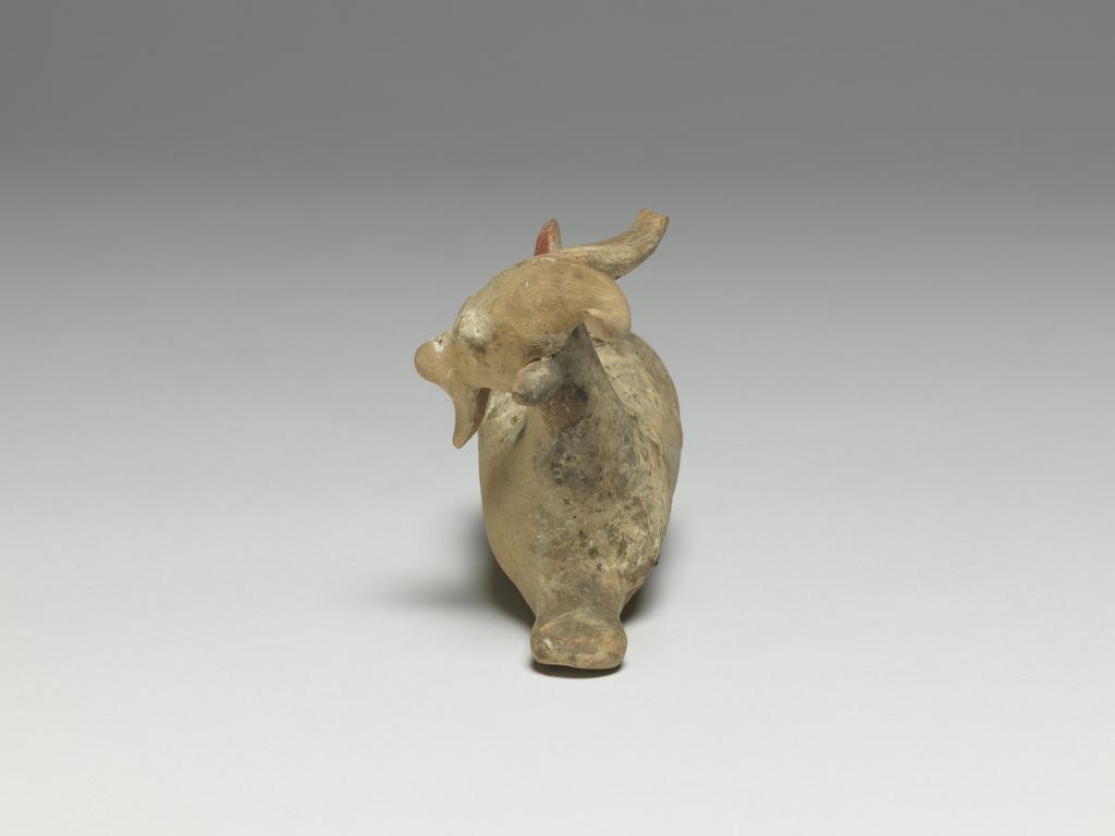 An image of Cosmetic Vessel. Goat, perfumed-oil container. Production Place: East Greece Turkey. Find Spot: Cyprus. Clay, height 0.083 m, length 0.135 m, 600-501 B.C. Archaic Period.