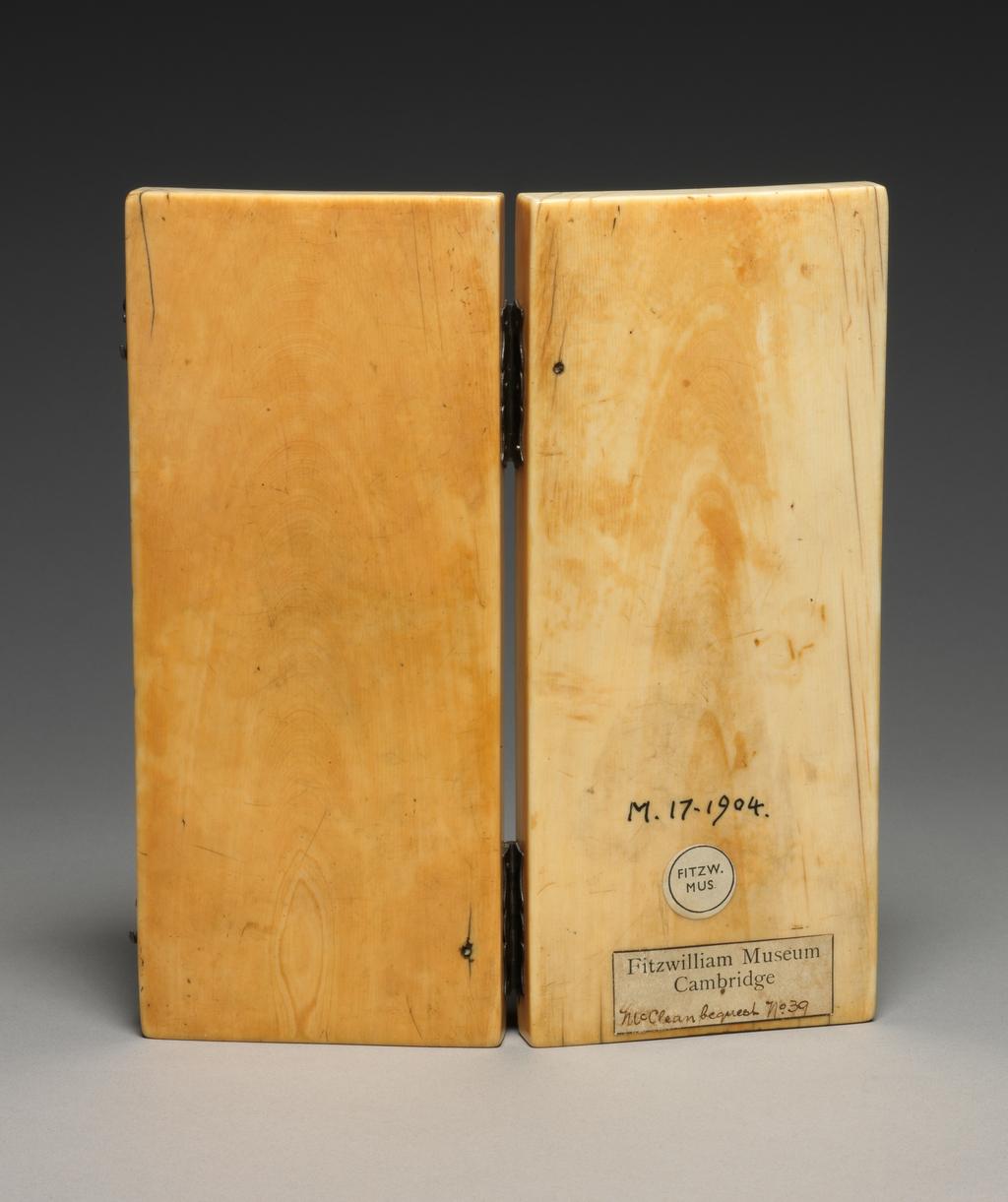 An image of Sculpture. Diptych with modern hinges. Carved with trefoil arches under which are the following scenes: a) Top left: Annunciation and Visitation; b) Bottom left: Virgin and Child with two angels; c) Top right: Last Judgement; d) Bottom right: Crucifixion with Virgin and St John. Ivory, carved, height, whole, 17.6 cm, width, whole, 7.6 cm, width, overall, 15.4 cm, circa 1300-1400. Gothic, Medieval. French.