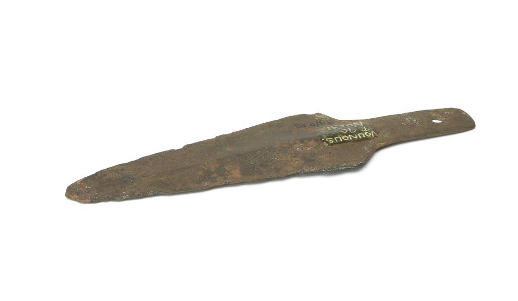 An image of Weapons. Dagger. Production Place: Cyprus. Find Spot: Vounous Cyprus; Tomb 90. Copper, length 0.113 m, width 0.03 m, 2400 to 2201 B.C. Early Cypriot I. Bronze Age.