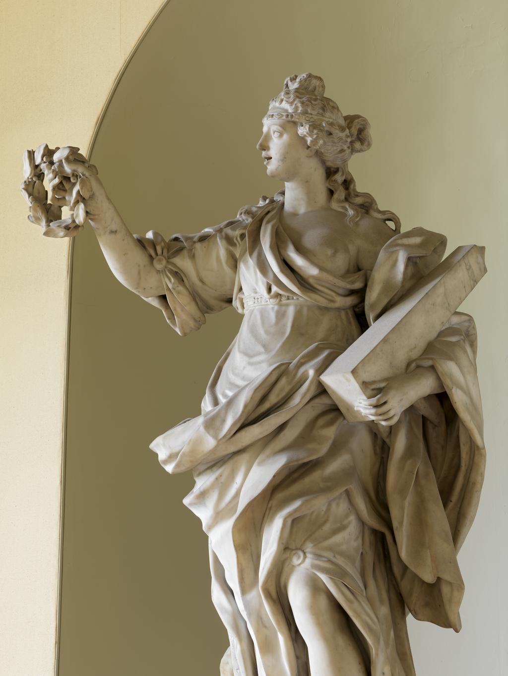 An image of BARATTA, Giovanni (the Younger)GloryCarrara white marble, carved in the round; on grey veined marble pedestal, with black marble cartouche. A full length figure of a woman, representing 'Glory' supported on a high pedestal.The inscription on the black marble is not the original as devised by James Brydges, first Duke of Chandos (1784-1744) which read: GLORIA MARLBURI, LAURO TUA TEMPORA CINGIT/DIVA LUBENS QUORSIUM? PAR DECUS INDE REFERT.C.1715Florence, Italy