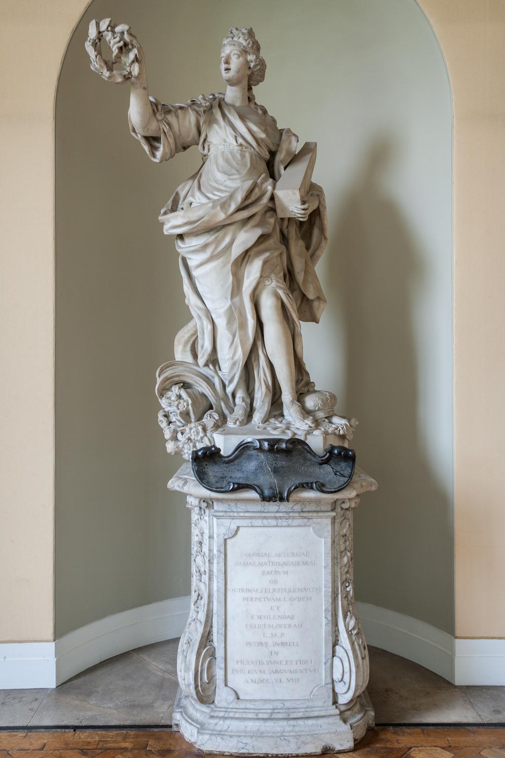 An image of BARATTA, Giovanni (the Younger)GloryCarrara white marble, carved in the round; on grey veined marble pedestal, with black marble cartouche. A full length figure of a woman, representing 'Glory' supported on a high pedestal.The inscription on the black marble is not the original as devised by James Brydges, first Duke of Chandos (1784-1744) which read: GLORIA MARLBURI, LAURO TUA TEMPORA CINGIT/DIVA LUBENS QUORSIUM? PAR DECUS INDE REFERT.C.1715Florence, Italy