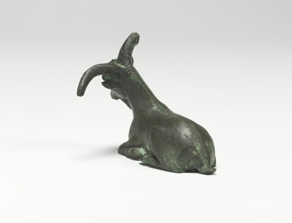 An image of Figure/Statuette. Goat. Production Place: Corinth, possibly. Bronze, height 0.047 m, width, 0.061 m, depth 0.048 m, maximum, 500-401 B.C. Classical Period.