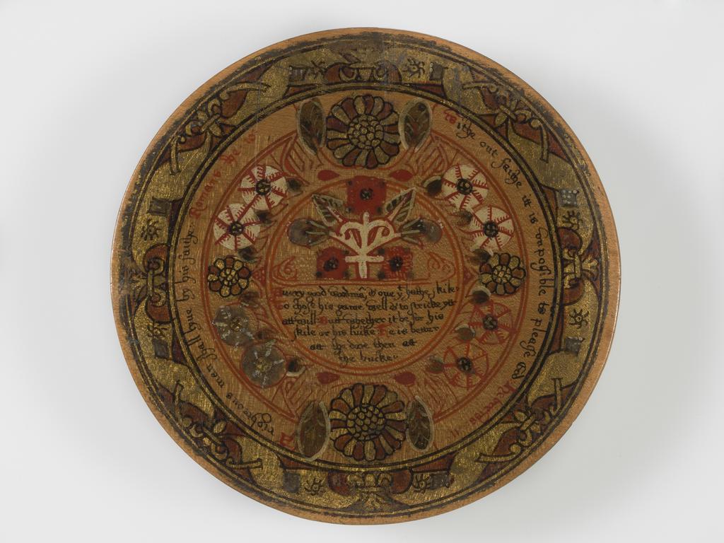 An image of Woodwork. Box of roundells. Box containing twelve trenchers. Wood, painted, gold decoration, height, box, 3.2 cm, diameter, box, 16.6 cm, diameter, roundels, 13.2 cm, circa 1600. Renaissance. Elizabeth I. English.