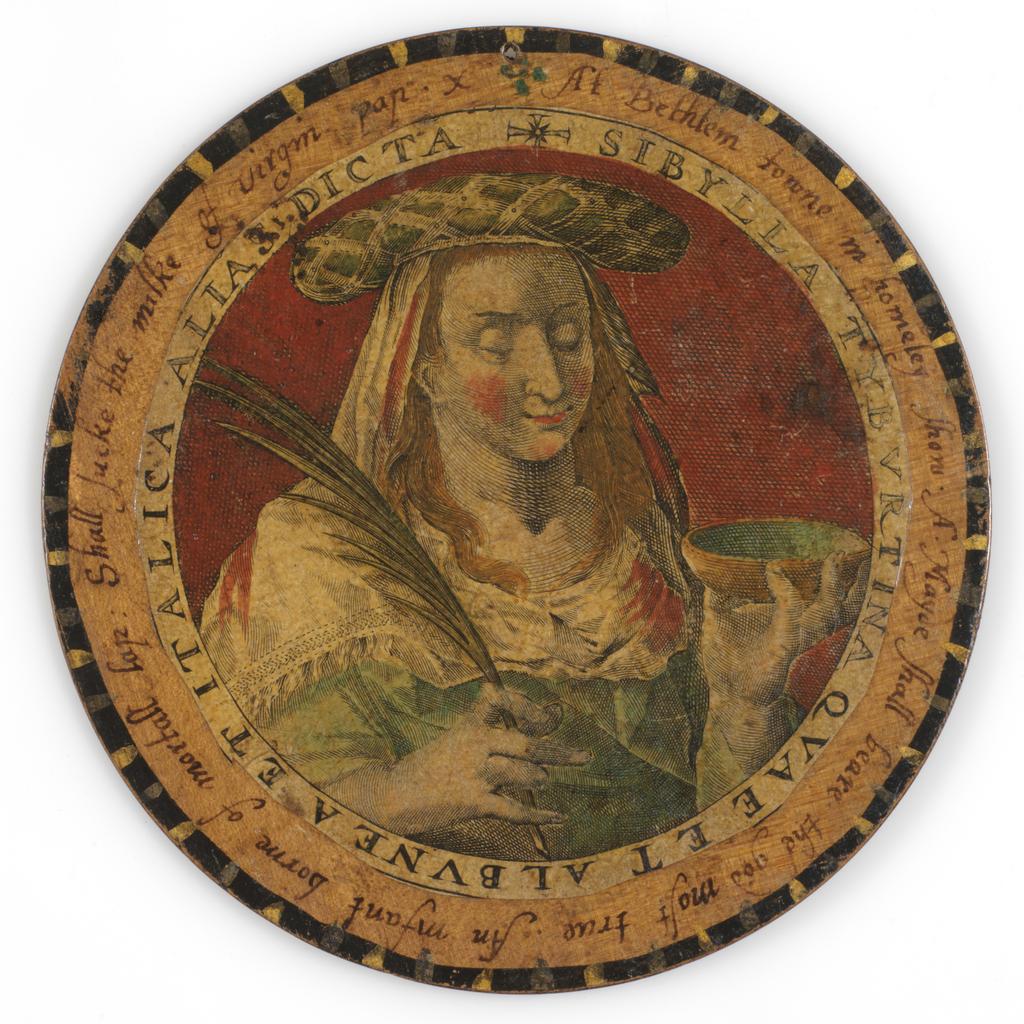 An image of Roundel or trencher. One of twelve wooden roundels, with an applied print of the Tiburtine Sibyl. Hand-coloured in red, green, ochre and black. Inscribed in black ink. Undecorated reverse. With a small hole near the top at the edge, diameter 13.7 cm. Part of M.5.1-13 & A-1920: Box containing twelve roundels or trenchers. Unknown maker, after Passe, Crispijn I de, printmaker (Flemish, 1564-1637). Circular box and cover of turned wood, containing twelve roundels. Each decorated with an applied hand-coloured engraving of a Sibyl, surrounded by a hand-written English inscription. Height, box, 6.7 cm, diameter, box, 17.1 cm, diameter, roundels, 13.7 cm, circa 1601 to circa 1625.