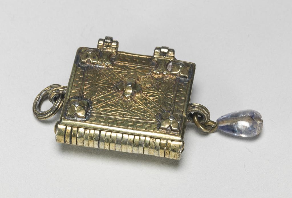 An image of Pendant Book. Jewellery/Pendant. Silver-gilt, with leaves made of silver and engraved with scenes from the Passion. Perhaps for attaching to a rosary, with pendant amethyst. Scenes: Annunciation, Nativity, Last Supper, Agony in the Garden, Kiss of Judas, Christ before Pilate, Scourying of Christ, The Mocking of Christ, Christ Carrying the Cross, the Erection of the Cross, Christ being Nailed to the Cross, the Crucifixion Deposition, Entombment, Resurrection, Christ Child Enthroned, a Pope and a female Saint. Silver-gilt, height, whole, 6.0 cm, width, whole, 2.8 cm, circa 1500- circa 1700. German.