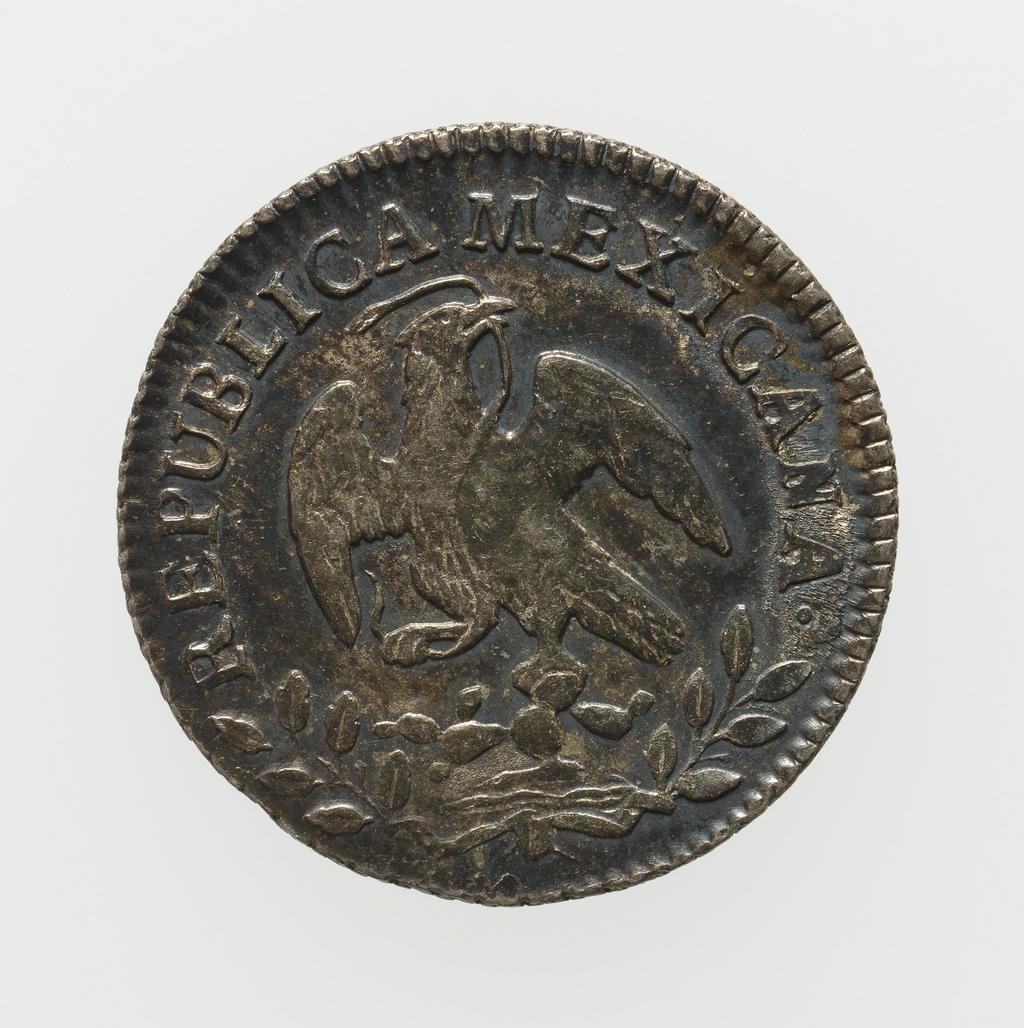An image of Coinage. Half Real. Mexico City mint. Silver, milled, diameter 17 mm, 1858. Acquisition: On loan from Queens' College Cambridge. Alternative Number: Q-4928.