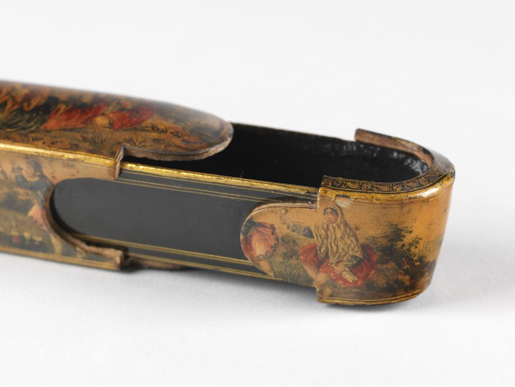 An image of Pen case/box. Unknown maker, Iran. Pen case, of lacquered and gilt wood, decorated on the top and sides with a young couple, attendant ladies and entertainers out-of-doors. Circa 1800-circa 1975. Qajar Period. Collection: Henry Scipio Reitlinger.