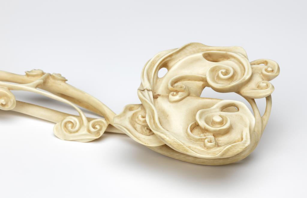 An image of Ruyi sceptre, in openwork with lingzhi fungi. Production Place: China. Ivory, carved. 18th century. Sir Victor Sassoon Chinese Ivories Trust.