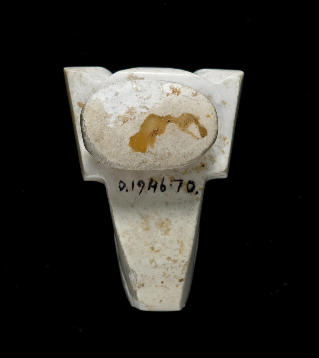 An image of Belt Hook. White jade with areas altered to opaque white, carved with a winged-body. A broad neck narrows to the hook, which terminates in a bird head. On the undecorated underside is a small oval stud. Nephrite, height 1.8 cm, length 2.9 cm, 400-200 B.C. Chinese.