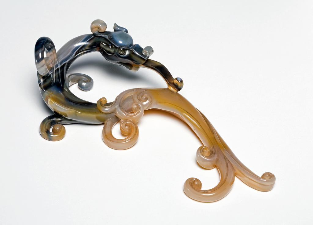 An image of Bifurcated rain-dragon of translucent chalcedony with dark greyish-blue agate markings. Chinese 1800-1900.