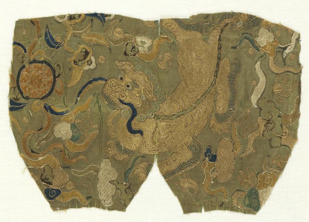 An image of Textiles. Fragment. Unknown maker, China. Design of lion (incomplete) and clouds, horn, cash, lozenge, etc. Silk satin, plain green ground; gold metallic thread and silk embroidery - blues, greens, black, yellow, beige and white. Stitches - couching, satin, cross, couched fillings, close herring-bone and raised work. Silk satin; whole; with silk embroidery, length, whole, 26, cm, width, whole, 17.5, cm, circa 1700. Acquisition Credit: Given by Mrs. Soame Jenyns, in accordance with the wishes of her late husband, Soame Jenyns.