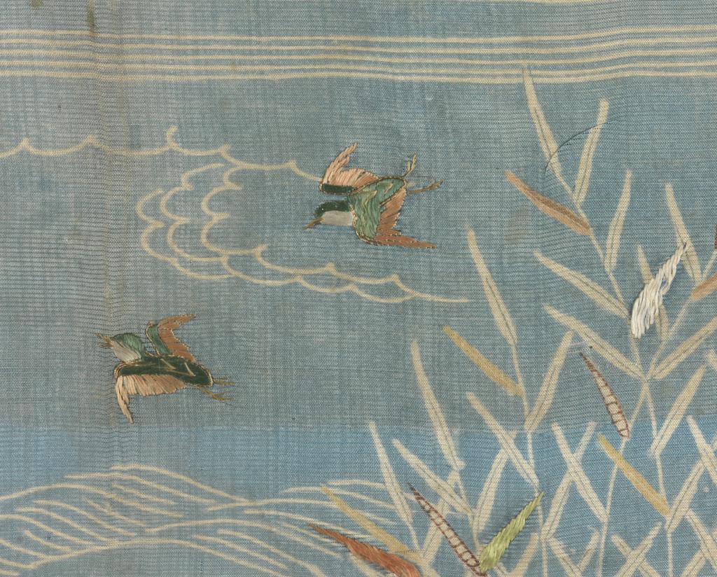 An image of Textiles. Sample. Unknown maker, Japan. River scene with bullrushes and ducks. Silk gauze, resist-dyed blue; painted and stencilled details in browns and yellows. Silk and metallic embroidery; satin, stem stitch and couching in green, orange, yellow and gold. Length, whole, 32 cm, width, whole, 24 cm, circa 1700. Acquisition Credit: Given by Mrs. Soame Jenyns, in accordance with the wishes of her late husband, Soame Jenyns.