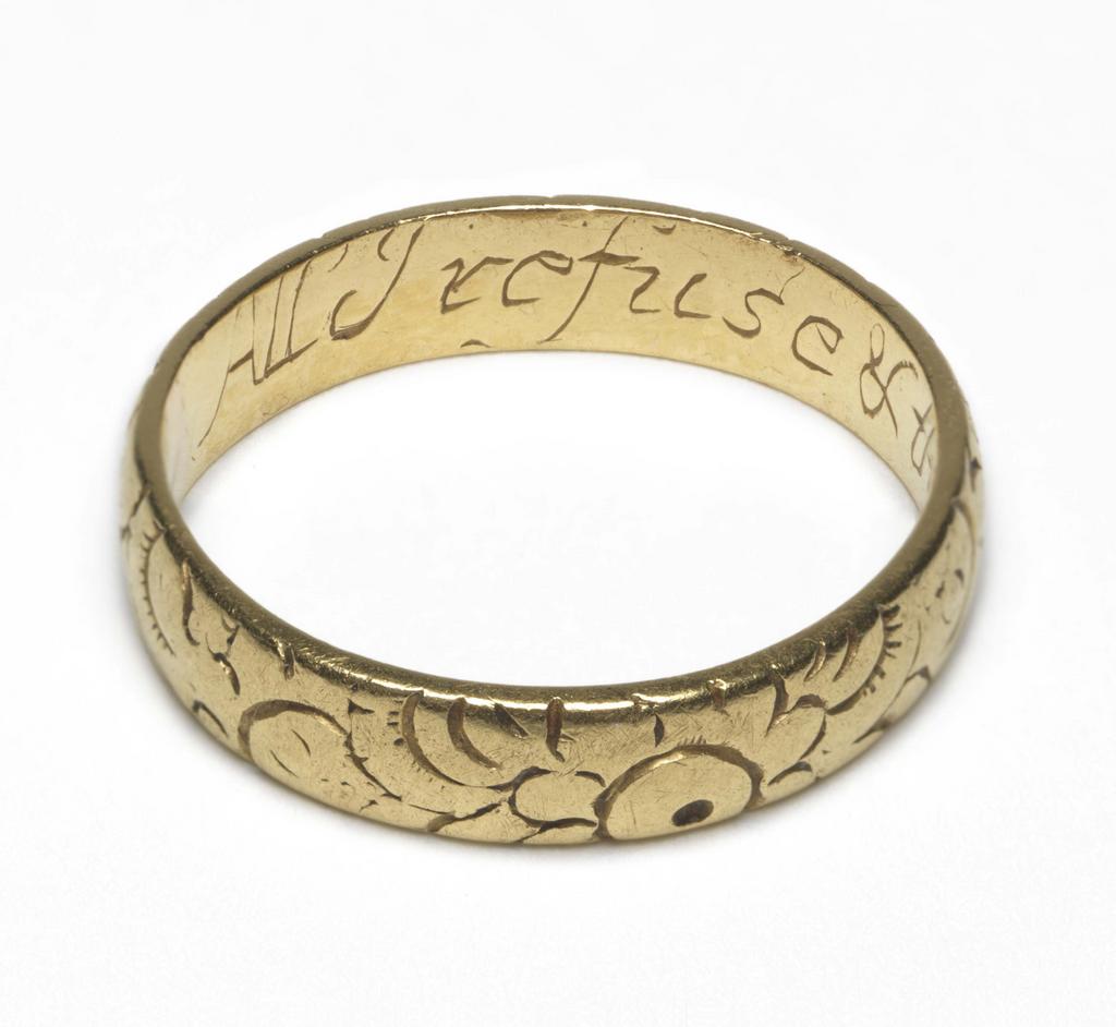 An image of Jewellery. Posy ring. Plain flat hoop, engraved on exterior with formalised flower designs. Inscribed inside: All I refuse and thee I chuse. Gold, height, whole, 4.5 mm, depth, whole, 1.5 mm, length, whole, 20.0 mm. Spencer George Perceval Collection.