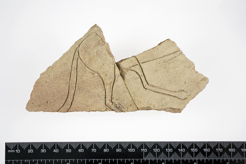 An image of Vessel. Body sherd from large buff ware jar, incised with rump, tail and belly of an onager. Find Spot: Tell es-Sweyhat, Syria. Clay, height 0.09 m, width 0.14 m, 2500-2001 B.C. Notes: The onager, also known as hemione or Asiatic wild ass (Equus hemionus) is a large Equid of the family Equidae (horse family) native to Asia.