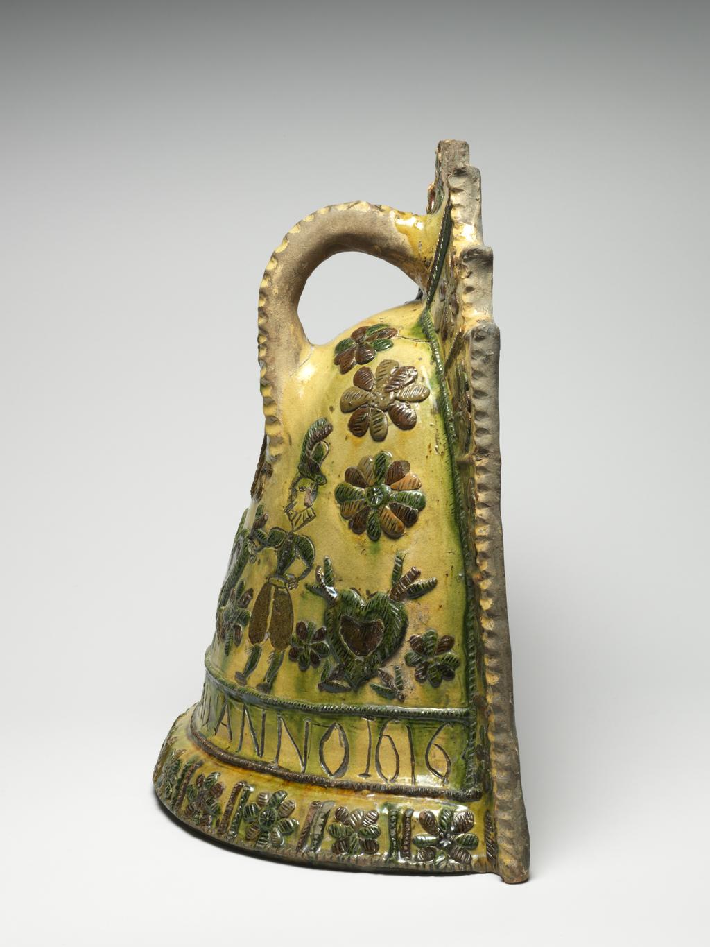 An image of Fire Cover/couvre feu. Lead-glazed earthenware. Production Place: Sorrus, France. Incised, ‘JACQVES BATBAU ANNO 1616’.