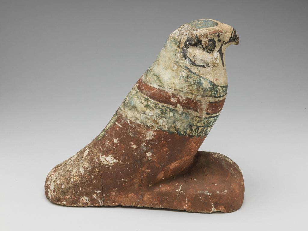 An image of Funerary Equipment/Figurine. Mummified falcon figure. Production Place: Egypt. Wood, height 0.165 m.