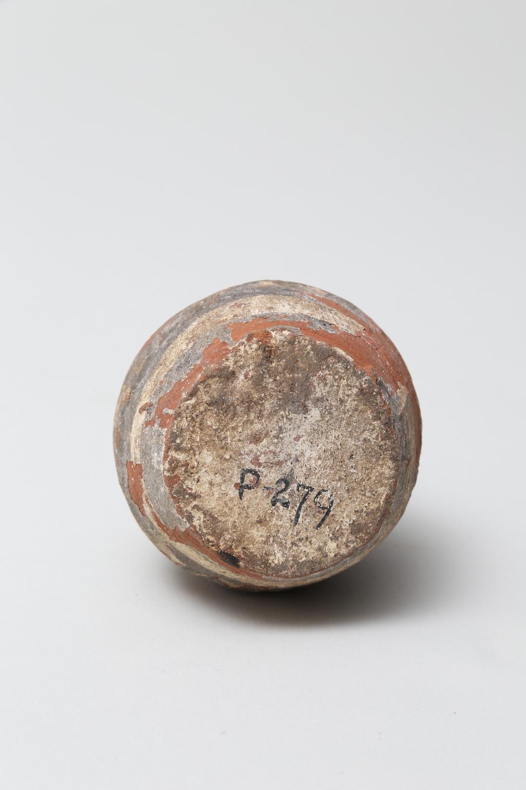 An image of Vessel. Jar, with decoration in black and red paint. Find Spot: Abydos?, Egypt. Production Place: Egypt. Height 0.065 m.