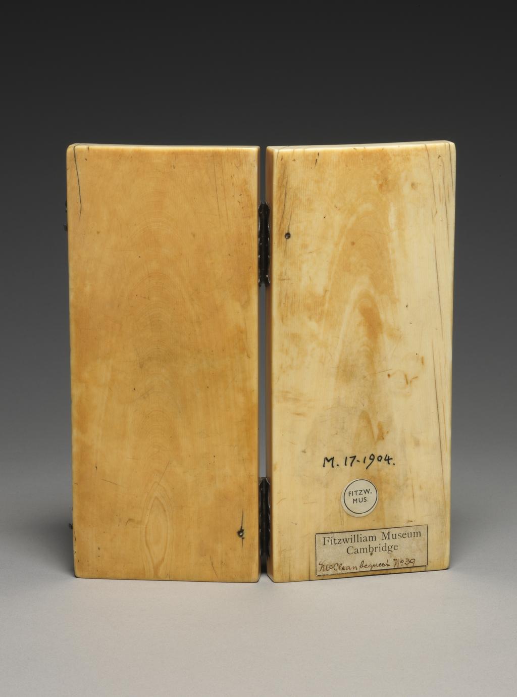 An image of Sculpture. Diptych with modern hinges. Carved with trefoil arches under which are the following scenes: a) Top left: Annunciation and Visitation; b) Bottom left: Virgin and Child with two angels; c) Top right: Last Judgement; d) Bottom right: Crucifixion with Virgin and St John. Ivory, carved, height, whole, 17.6 cm, width, whole, 7.6 cm, width, overall, 15.4 cm, circa 1300-1400. Gothic, Medieval. French.