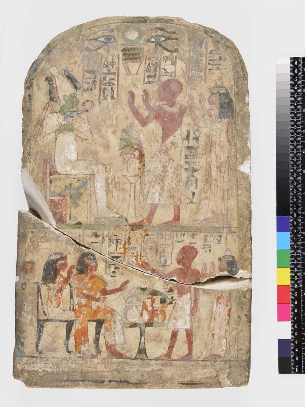 An image of Architectural Element/Stelae. Stela, round topped and painted, of Meh and his wife Nebty, before Osiris. Production Place: Egypt. Find Spot: Deir el Medina? Egypt. Limestone, height 0.435 m, width 0.275 m, depth 0.075, m, circa 1290-1185 B.C. Nineteenth Dynasty. New Kingdom. Notes: Inscription; before Osiris; painted; Hetep-di-nesu formula to Osiris, the great god, lord of the west.